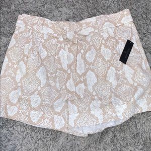 Snake print belted shorts